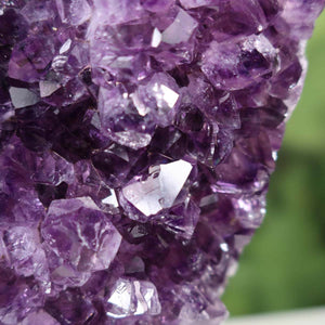 Close-up of vibrant dark purple Uruguay Amethyst Drusen showcasing highly regular and sparkling crystals