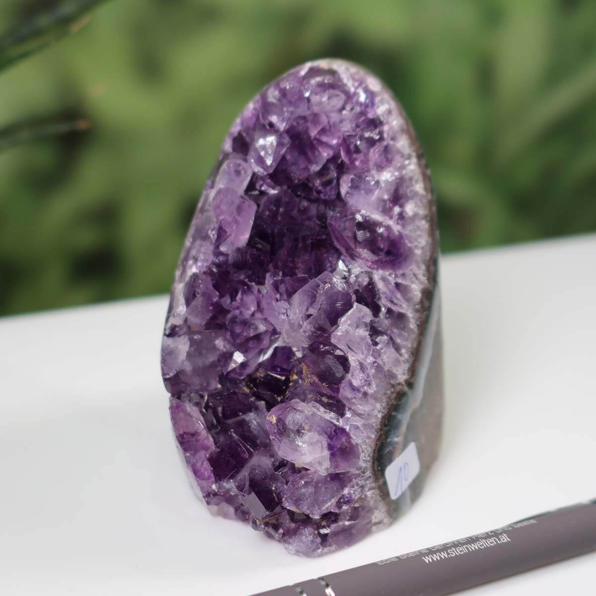 Uruguay Amethyst mini geode with intense purple crystals, unique piece number 10 on display