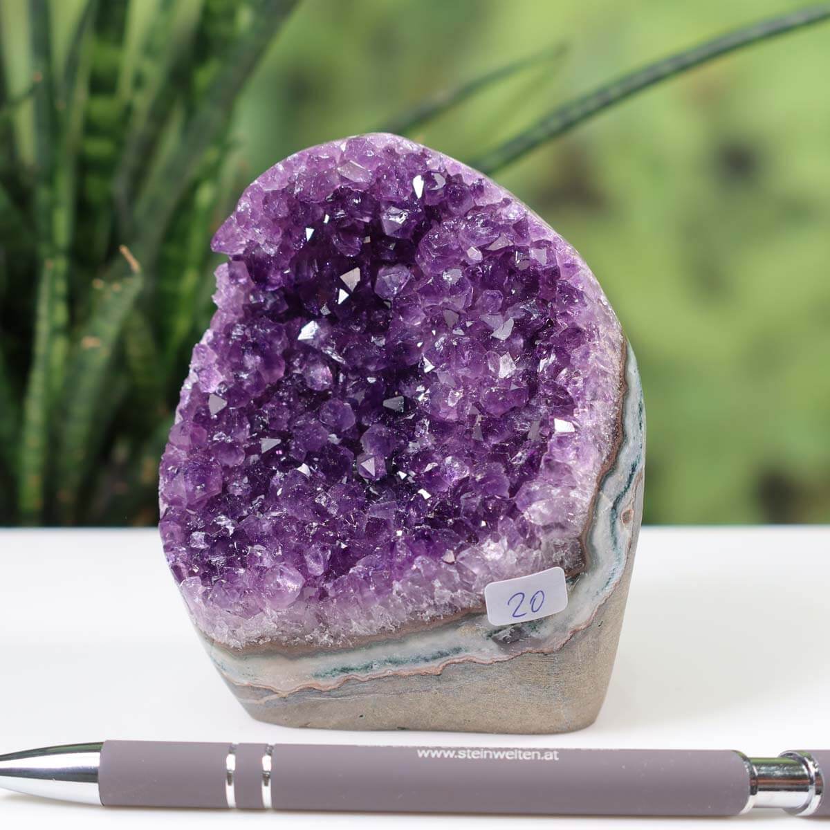 Uruguay Amethyst Mini Geode with rich violet crystals, labeled Unikat NR 20, displayed with a pen for scale.