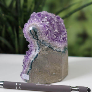 Uruguay Amethyst Mini Geode with deep violet crystals, unique piece number 22 displayed against a natural backdrop.