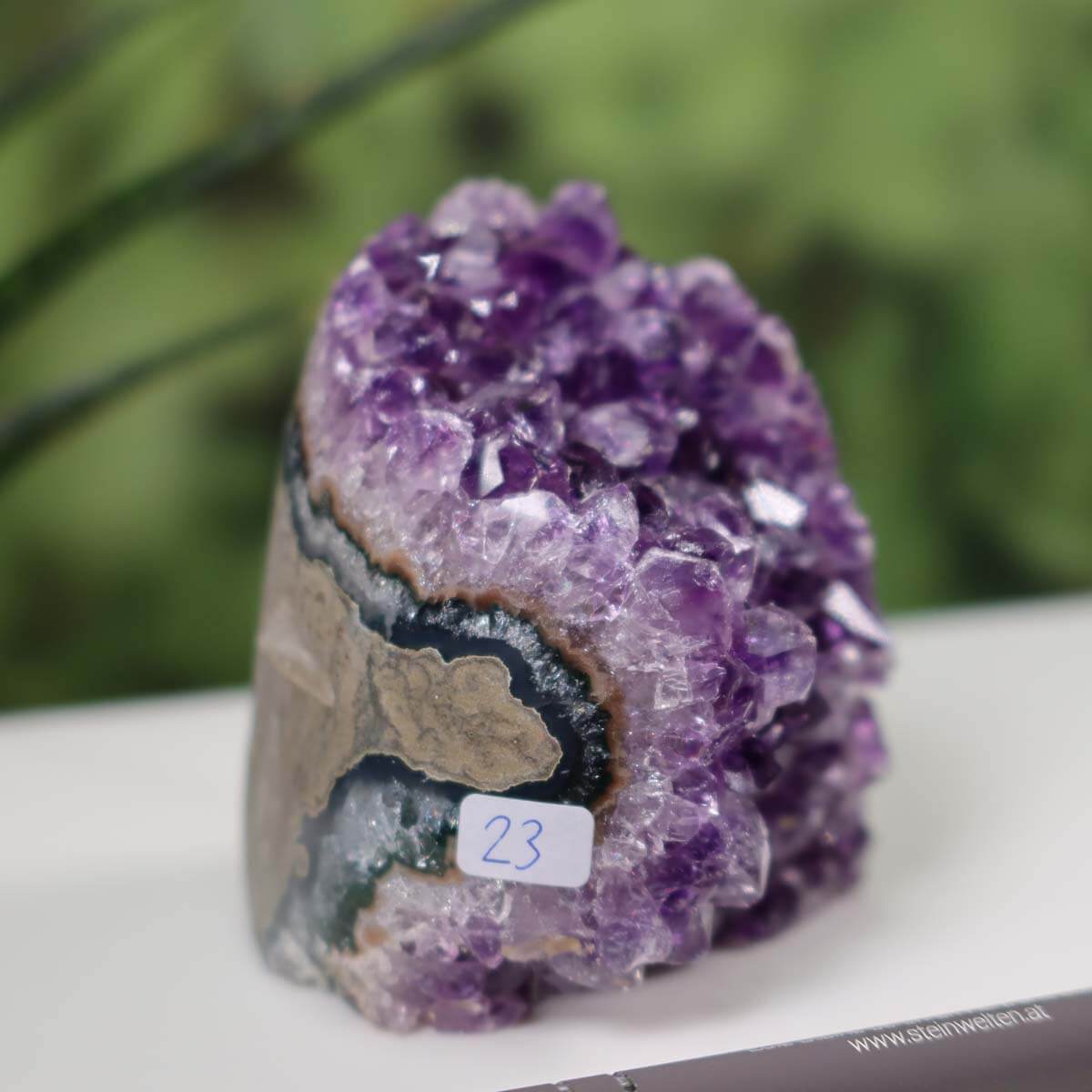 Intense purple Uruguay Amethyst mini geode unique piece number 23 on display