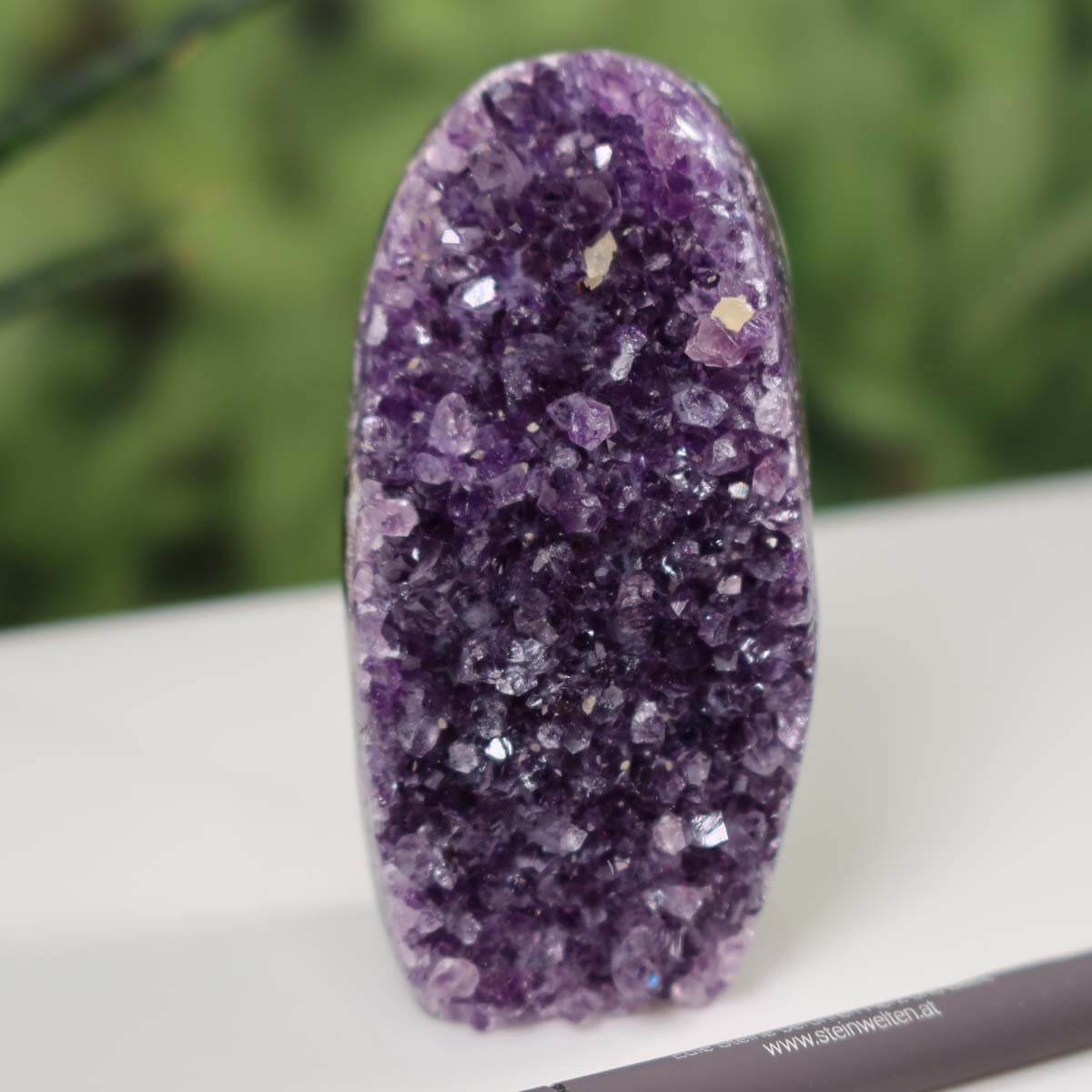 Intense purple Uruguay Amethyst mini geode with natural crystal formations, unique piece NR 24 on display