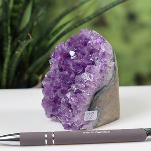 Uruguay Amethyst Mini Geode with deep violet crystals, displayed with number 28 label and pen, intense sparkle and natural formation.