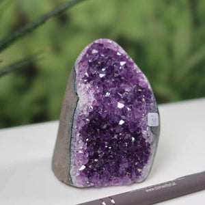 Dark purple Uruguay Amethyst Mini Geode with intense violet crystals, displayed in natural setting, product number 30.