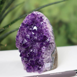 Intense purple Uruguay Amethyst mini geode, unique piece number 35, with deep violet crystals on display