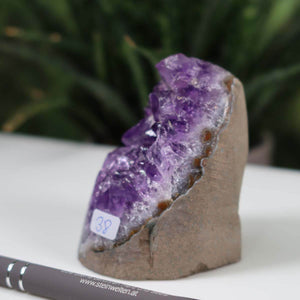 Intense purple Uruguay Amethyst mini geode, uniquely numbered 38, displayed with natural crystal clusters