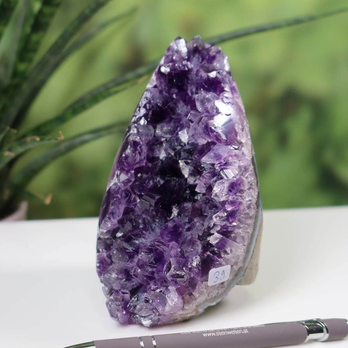 Intense purple Uruguay Amethyst Mini Geode, product number 39, displayed with natural background and pen for scale.