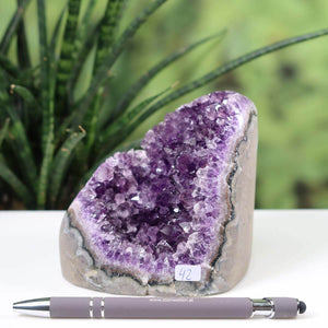 Uruguay Amethyst mini geode, intense purple crystals, displayed with pen for scale, item number 42