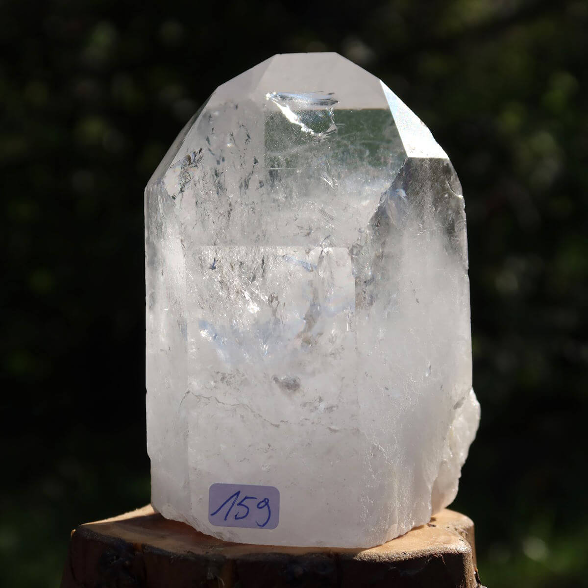 Polished quartz crystal point from Brazil, numbered 159, ideal for clarity and meditation.