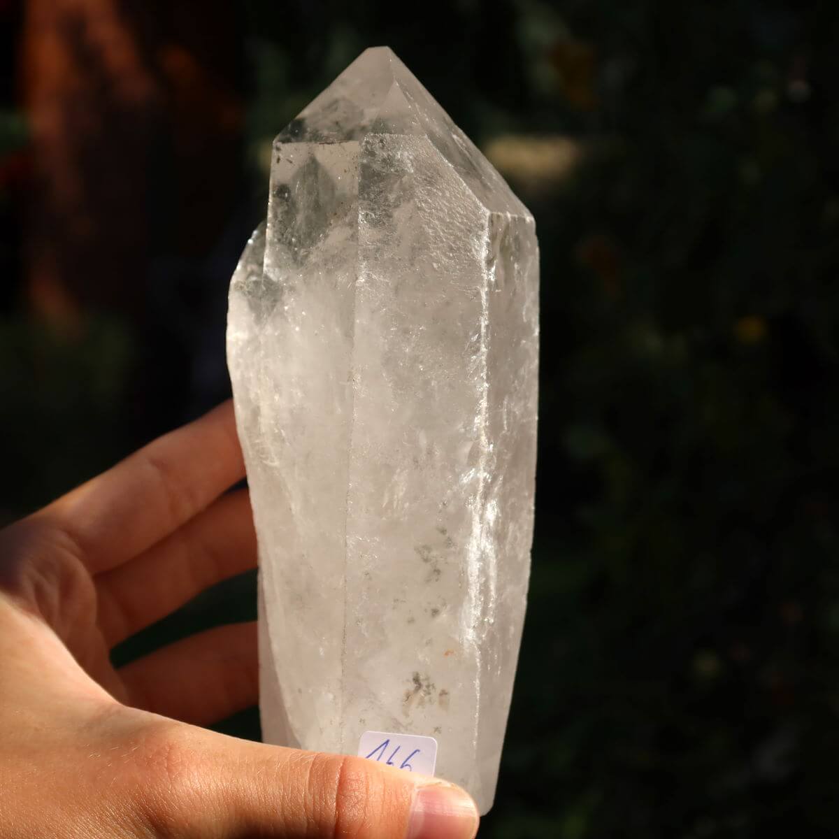 Hand holding unique Bergkristall quartz crystal point, No. 166, 13x5 cm, for clarity and meditation, Brazil origin.