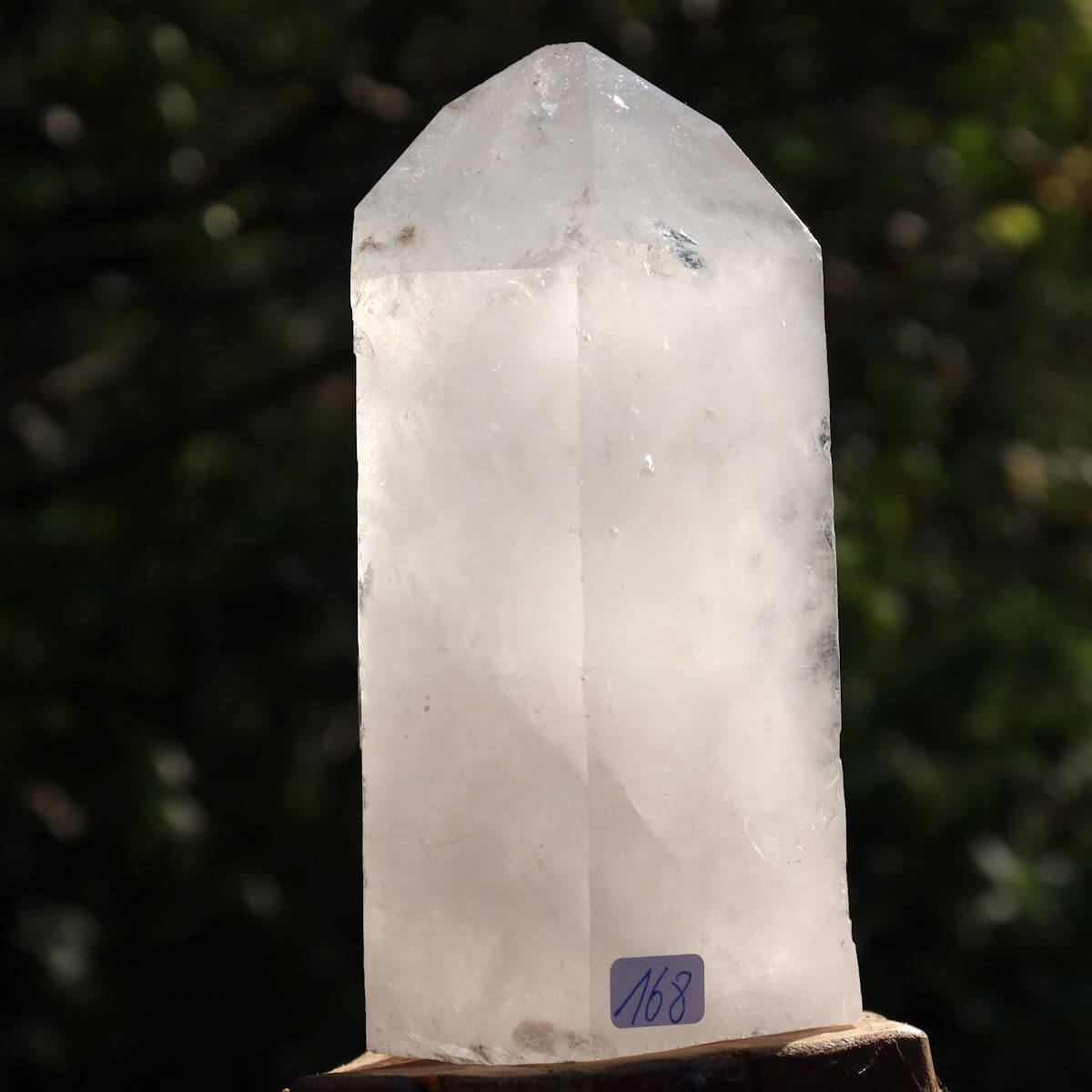 Clear quartz crystal point with faceted surfaces, number 168, 12x8 cm, for clarity and meditation, from Brazil.