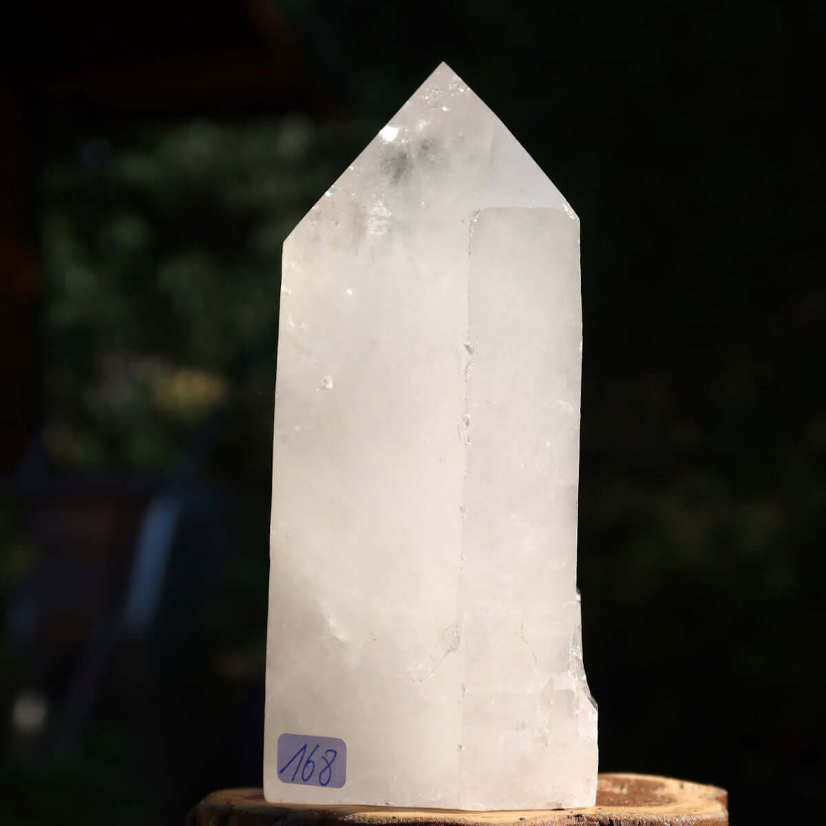 Clear quartz crystal point with faceted surfaces, number 168, 12x8 cm, for clarity and meditation, from Brazil.