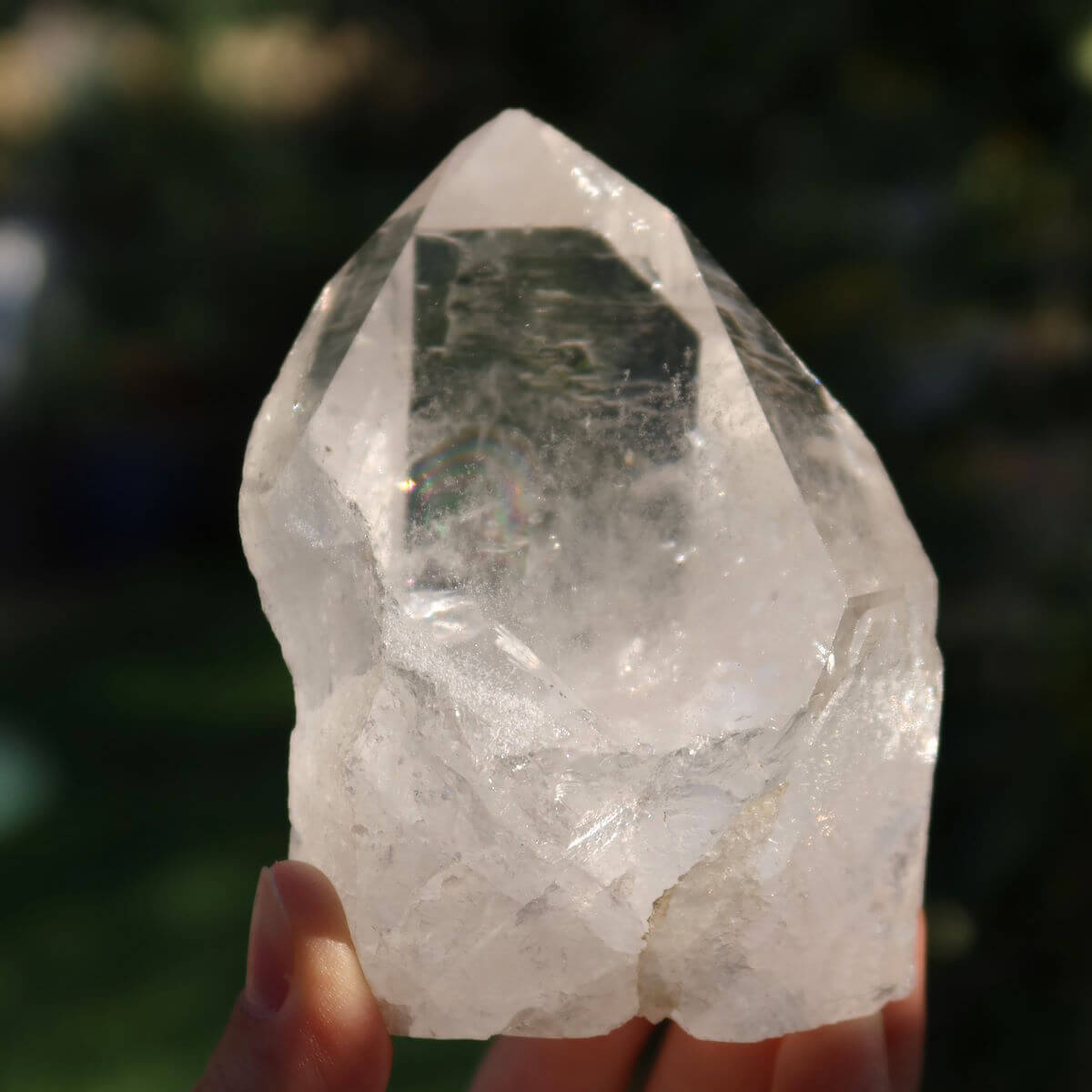 Polished Brazilian quartz crystal spike for clarity and meditation, unique gem with sparkling facets, 9x6 cm.