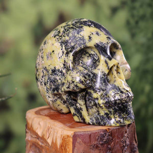 Handcrafted crystal skull from natural stone with unique patterns, 10x8 cm, collectible art piece for sale at Steinwelten.