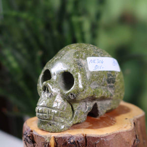 Handcrafted crystal skull made from natural stone with unique patterns, collectible item from Steinwelten, available online.